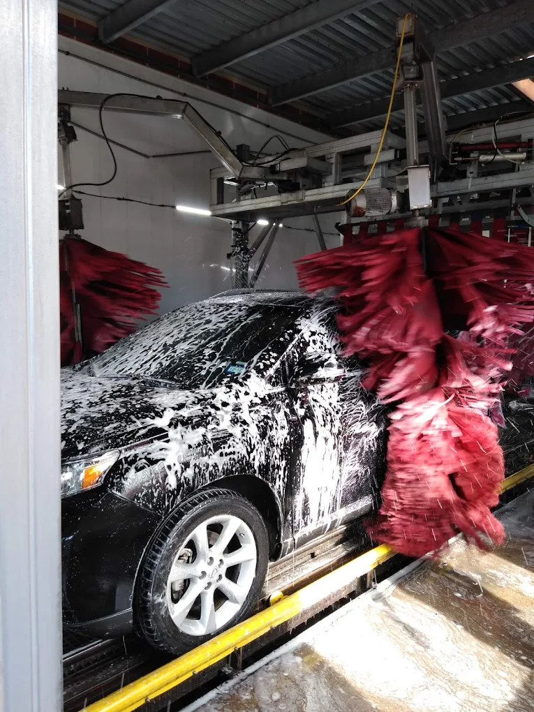 Close-up of brushes cleaning a car